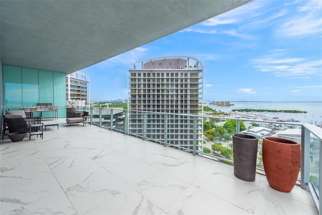 balcony featuring a water view