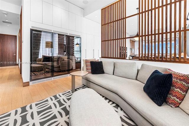 living room featuring plenty of natural light and wood-type flooring