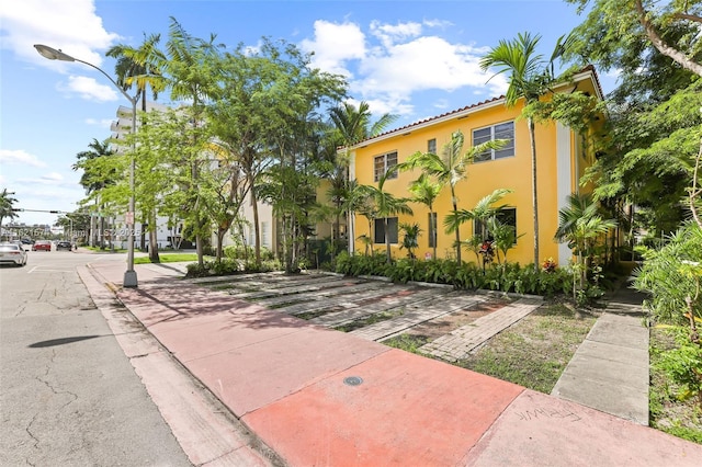 1310 15th St, Miami Beach, FL 33139 - view of front facade featuring stucco siding and a tiled roof