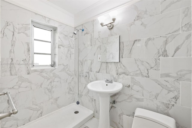 bathroom with a shower, toilet, and ornamental molding