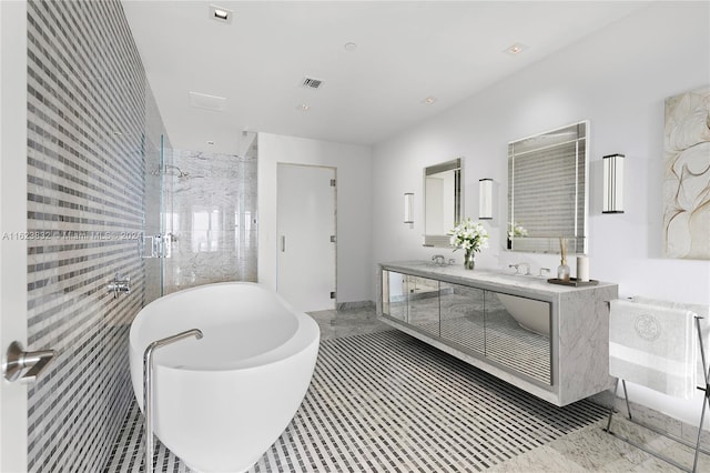 bathroom with tile patterned flooring, shower with separate bathtub, and dual bowl vanity