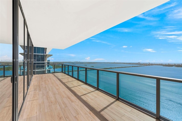 balcony featuring a water view