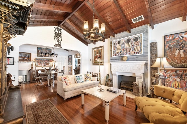 living room with high vaulted ceiling, beamed ceiling, wooden ceiling, wood-type flooring, and a notable chandelier