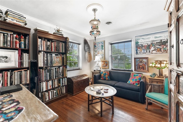 living room with ornamental molding and dark hardwood / wood-style floors