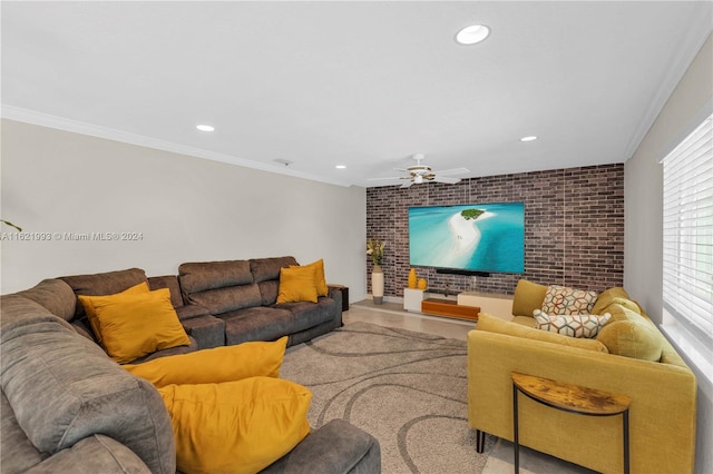 living room featuring ornamental molding, brick wall, and ceiling fan