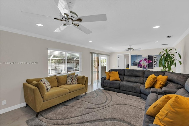 living room with plenty of natural light, ceiling fan, and ornamental molding