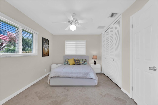 tiled bedroom with ceiling fan