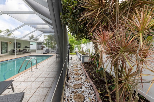 view of pool featuring a lanai and a patio area