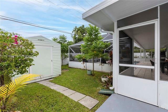 view of yard with a storage unit