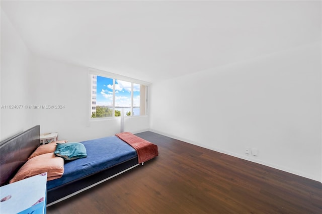 bedroom featuring dark hardwood / wood-style floors