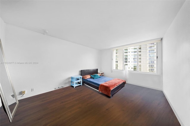 bedroom featuring dark hardwood / wood-style floors