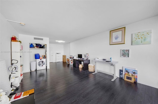 home office featuring washer / clothes dryer and wood-type flooring