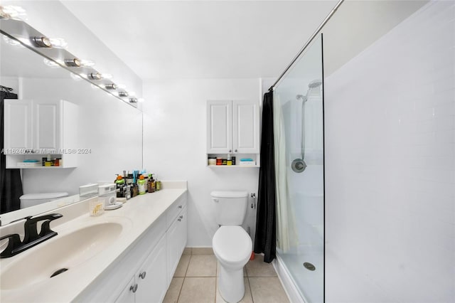 bathroom with vanity, tile patterned flooring, a shower with shower curtain, and toilet