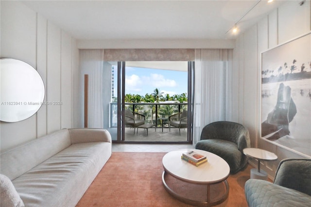 living room featuring light tile patterned floors and track lighting