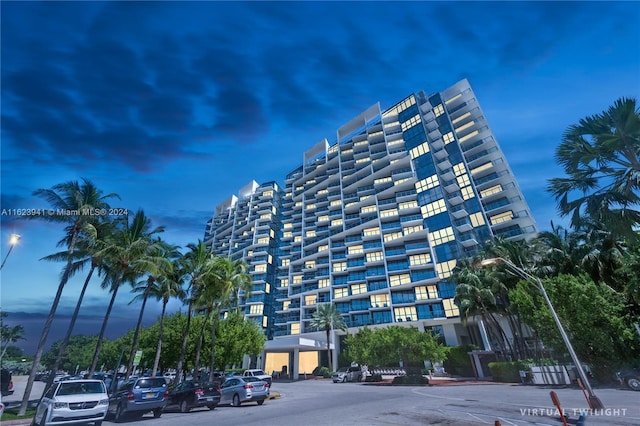 view of outdoor building at dusk