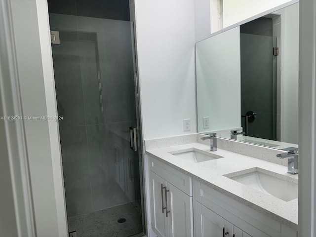 bathroom with vanity and an enclosed shower