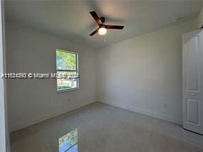 unfurnished room featuring ceiling fan