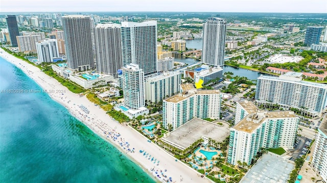 bird's eye view featuring a water view and a view of the beach