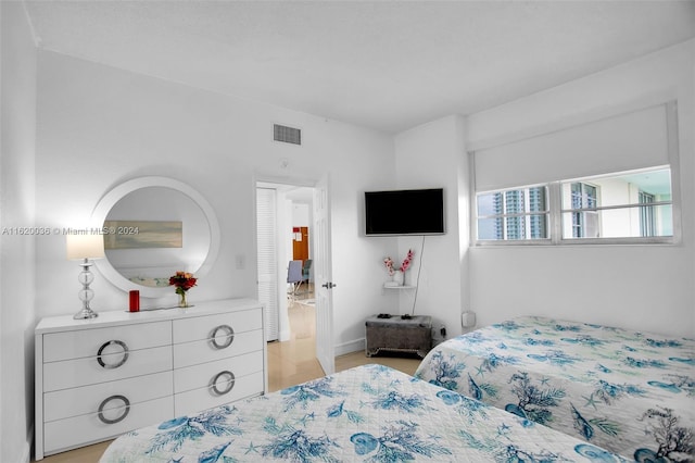 bedroom featuring light wood-type flooring