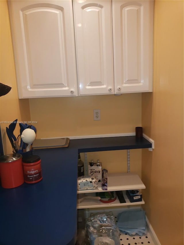 details featuring white cabinetry and tile patterned flooring