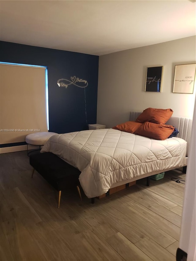 bedroom featuring hardwood / wood-style floors