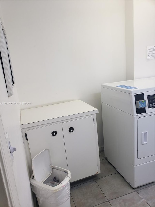 laundry area featuring washer / clothes dryer and tile patterned floors