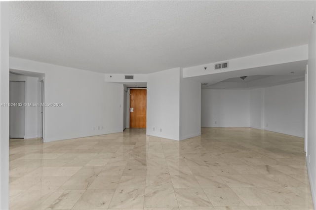 20185 E Country Club Dr Unit 502, Aventura, FL 33180 - empty room with visible vents and a textured ceiling