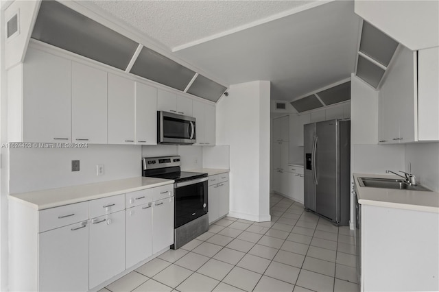 20185 E Country Club Dr Unit 502, Aventura, FL 33180 - kitchen featuring a sink, stainless steel appliances, visible vents, white cabinetry, and light countertops
