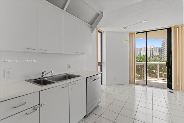 20185 E Country Club Dr Unit 502, Aventura, FL 33180 - kitchen with stainless steel dishwasher, a sink, floor to ceiling windows, and light countertops