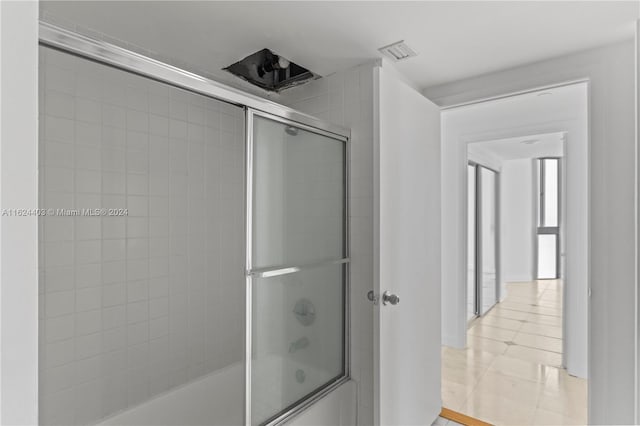 20185 E Country Club Dr Unit 502, Aventura, FL 33180 - bathroom with tile patterned flooring, visible vents, and enclosed tub / shower combo
