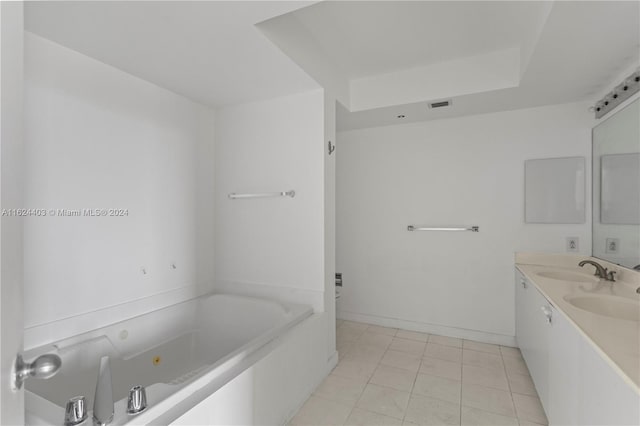 bathroom with tile patterned flooring and double sink vanity