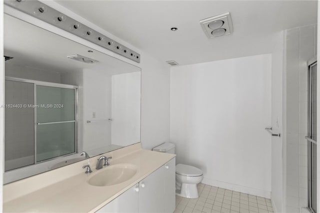 20185 E Country Club Dr Unit 502, Aventura, FL 33180 - bathroom with tile patterned floors, an enclosed shower, toilet, and vanity