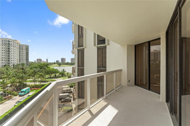 20185 E Country Club Dr Unit 502, Aventura, FL 33180 - balcony featuring a view of city and a water view