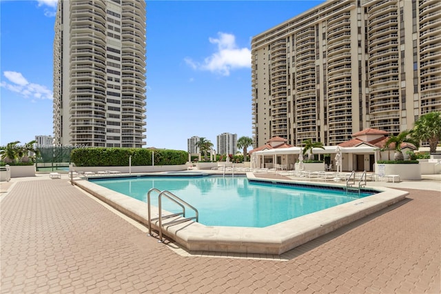 view of swimming pool with a patio area