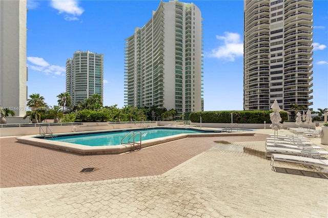 view of swimming pool featuring a patio