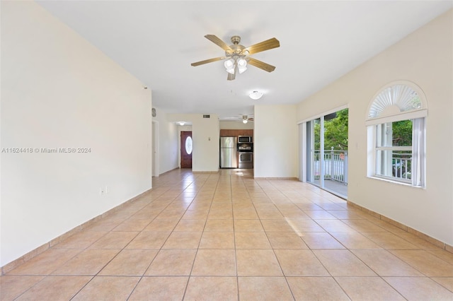 tiled empty room with ceiling fan