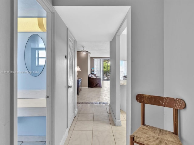 hall with light tile patterned flooring