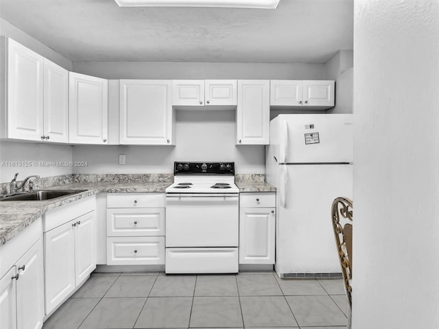 kitchen with white cabinetry, white appliances, sink, and light tile patterned floors