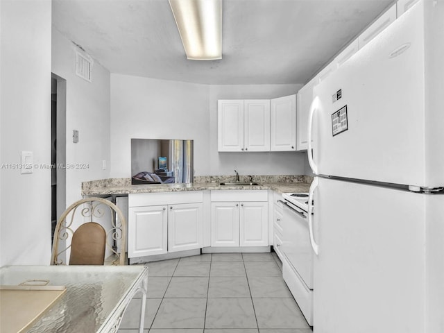 kitchen featuring white cabinetry, sink, light stone counters, and white appliances