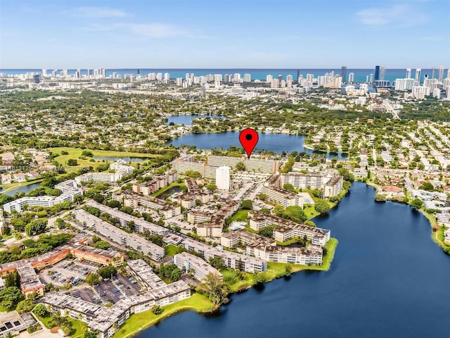 birds eye view of property featuring a water view