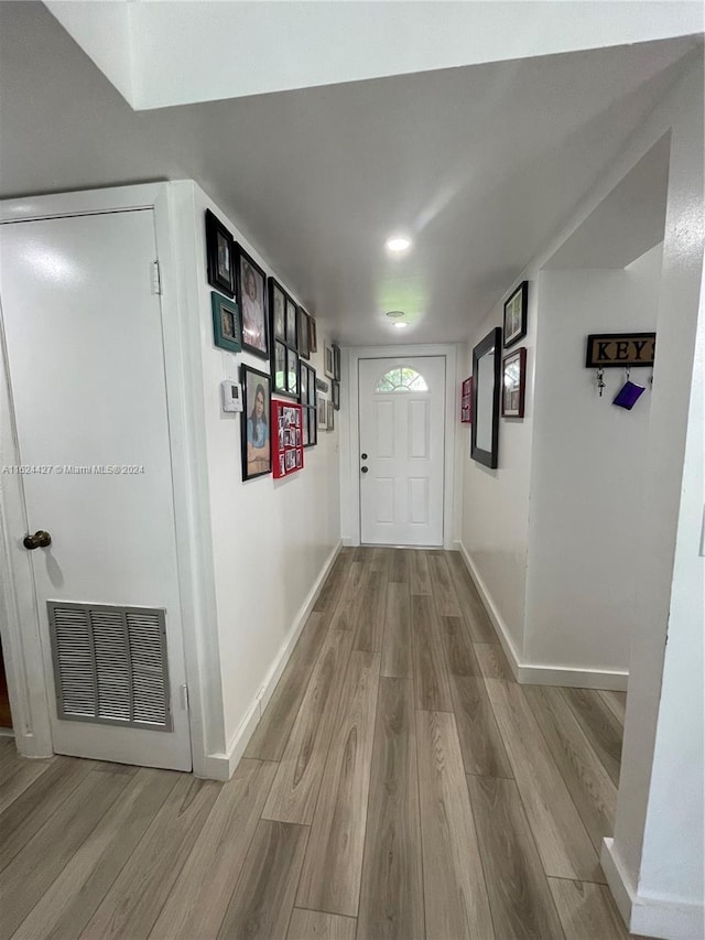 hallway featuring wood-type flooring