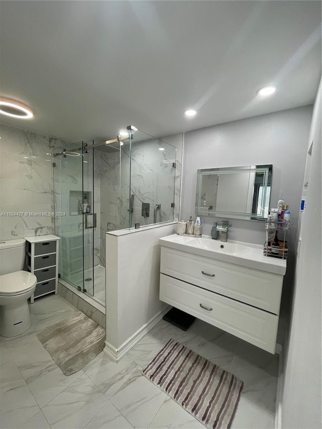 bathroom featuring tile patterned flooring, toilet, vanity, and an enclosed shower