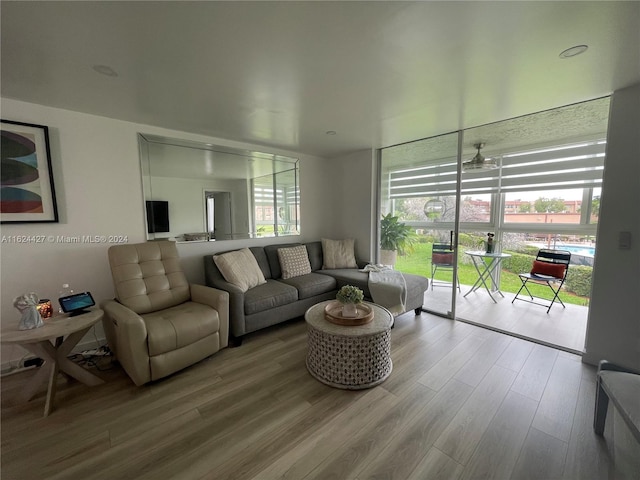 living room with a wealth of natural light and hardwood / wood-style floors