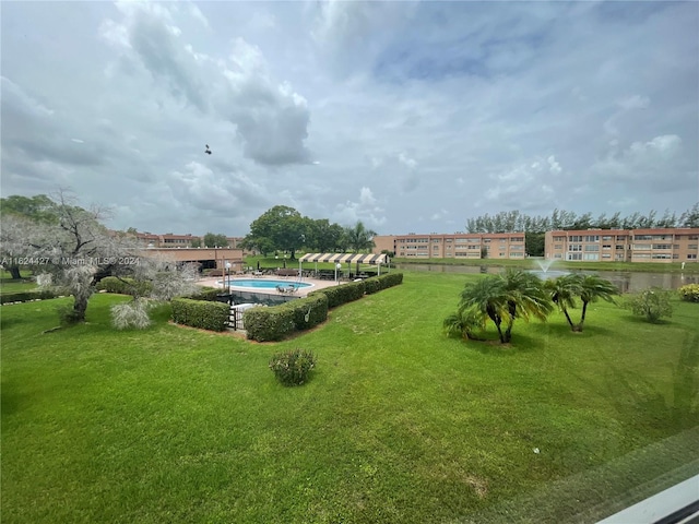 view of yard featuring a community pool