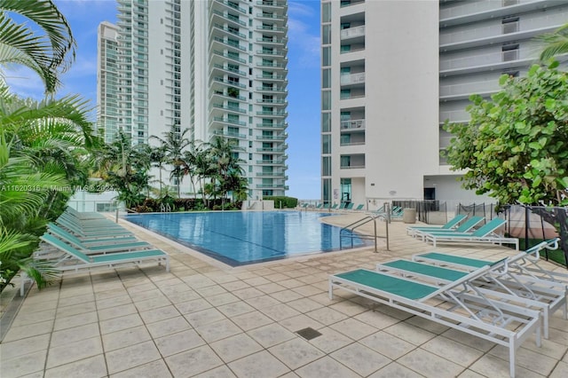 view of swimming pool with a patio area