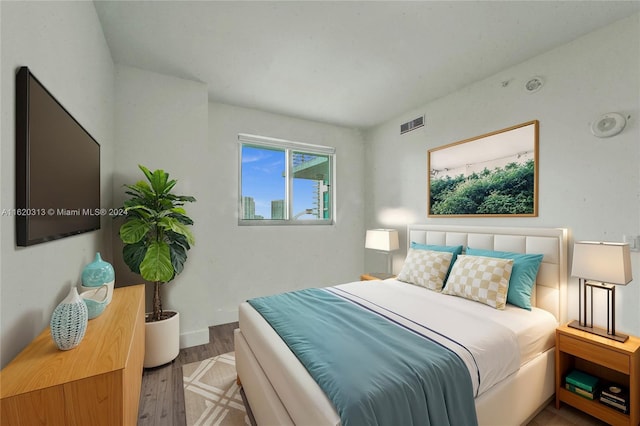 888 Biscayne Blvd Unit 1805, Miami, FL 33132 - bedroom with visible vents and wood finished floors