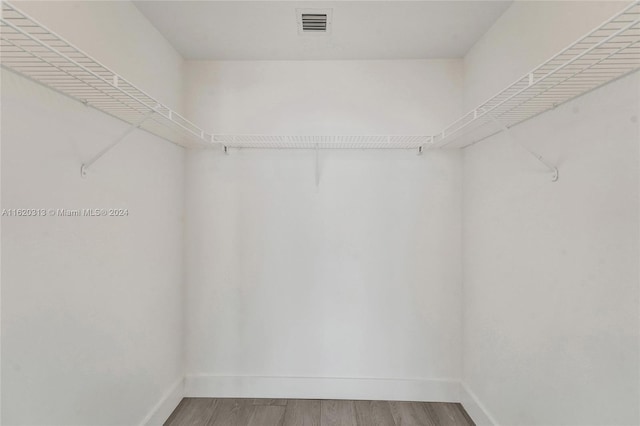 888 Biscayne Blvd Unit 1805, Miami, FL 33132 - spacious closet with wood finished floors and visible vents