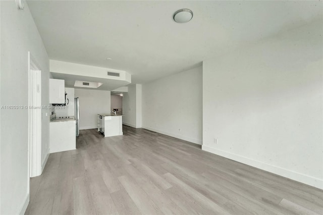 888 Biscayne Blvd Unit 1805, Miami, FL 33132 - unfurnished living room featuring baseboards, light wood-type flooring, and visible vents