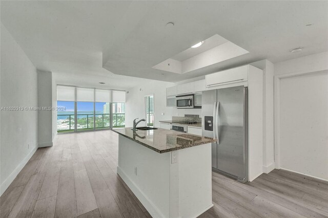 888 Biscayne Blvd Unit 1805, Miami, FL 33132 - kitchen with a sink, light wood-type flooring, baseboards, white cabinets, and appliances with stainless steel finishes