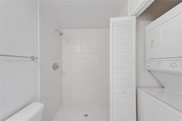 888 Biscayne Blvd Unit 1805, Miami, FL 33132 - bathroom featuring a stall shower, stacked washer and dryer, and toilet
